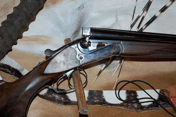 A hunter prepares to take a shot with his rifle.